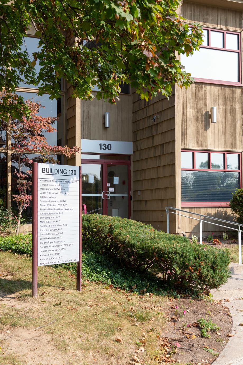 Building 130 Allens Creek Office Park Sign out front for Financial Freedom Group in Rochester, NY